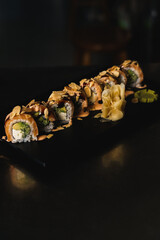 sushi on a black background.Fresh rolls on a tray on a black background
