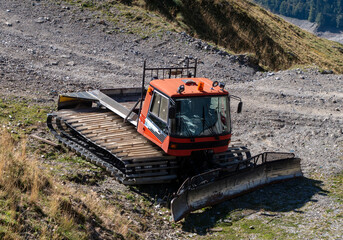 snow groomer machine abandoned in summer at ski resort