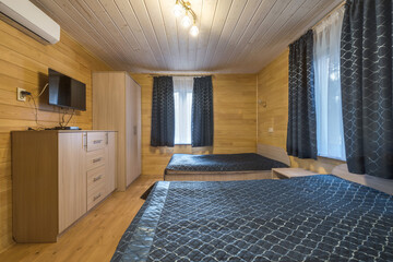 interior of wooden eco bedroom in studio apartments,  hostel or homestead