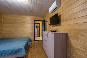 interior of wooden eco bedroom in studio apartments,  hostel or homestead