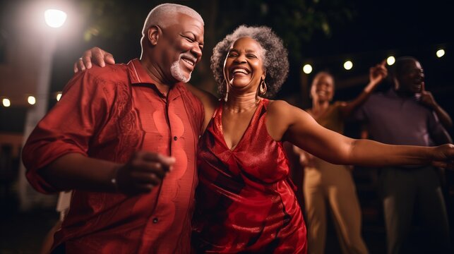 A content senior African American couple dancing salsa at a social event