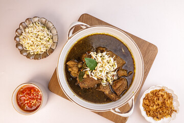 Rawon is Indonesian Black Beef Soup, Utilezes the Black Keluak Nuts as the main Seasoning.