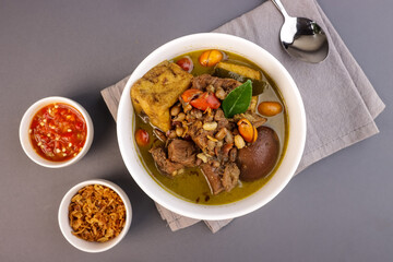 Brongkos is a Yogyakarta Spicy Meat and Bean Stew with a Special Spice, Kluwek in Coconut Milk Soup.
