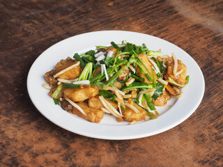 stir fried Chinese turnip or radish cake with spring onion and bean sprout