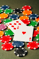 Playing cards and chips on green background