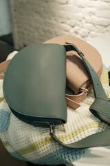 The choice of clothes, the girl's hand in choosing a dress, an outfit on a hanger in the wardrobe in the room, a closet at home. Wardrobe in the house. Clothes for women. Bags. Clothing store.