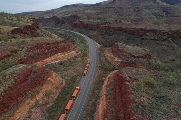 Aerial drone photo of road train travelling through remote WA landscape