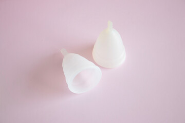 Fototapeta na wymiar Menstrual cups minimalistic image flat top view background with copy space.