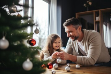 Father and daughter decorate a Christmas tree - obrazy, fototapety, plakaty