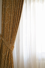 Beautiful brown curtains with a pattern. This photo shows beautiful curtains that would be the perfect addition to any home.