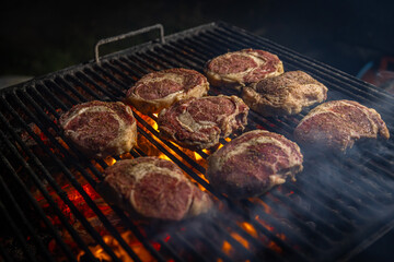 Beef steaks on grill