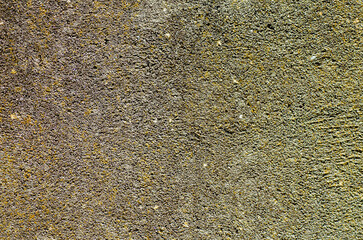 detail of a aged wall covered with cement, textured background