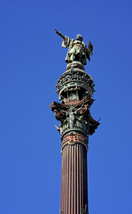 Fototapeta na wymiar Monument of Christopher Columbus in the harbor of Barcelona against the blue sky, Catalonia, Spain
