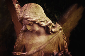Fototapeta premium Angel in the sunlight (architecture, statue, archetype, religion, faith). Horizontal image.