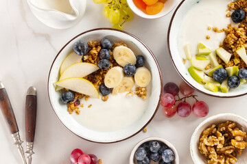 Weight loss, healthy lifestyle and eating. Two healthy breakfast bowl with ingredients granola...