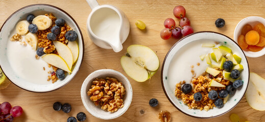 Weight loss, healthy lifestyle and eating. Two healthy breakfast bowl with ingredients granola...