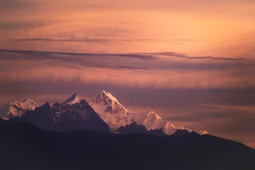 Foto auf Acrylglas Kangchendzönga Mount kangchenjunga peak of Himalayan mountains during sunrise. Snow clad golden white peaks under cloud cover as seen fro kalimpong india.