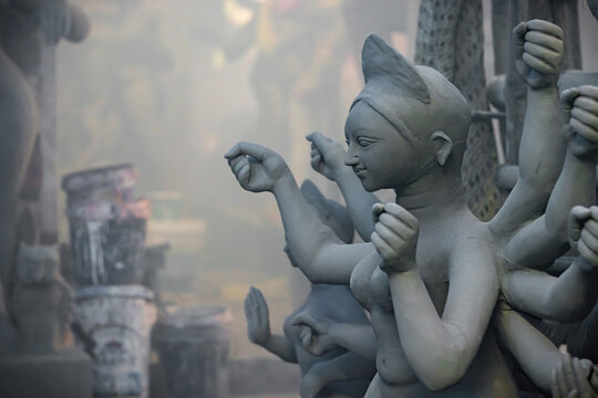 clay idol of goddess durga being sculpted during durga puja festival in india. It is the biggest festival of west bengal. Goddess durga symbolizes woman empowerment.