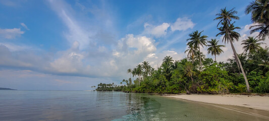 Fantastic tropical landscape with beach and clear clean sea on a sunny day.