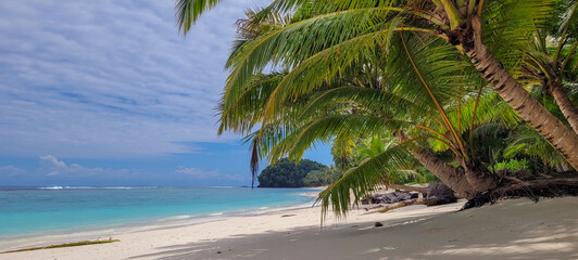 Fantastic tropical landscape with beach and clear clean sea on a sunny day.