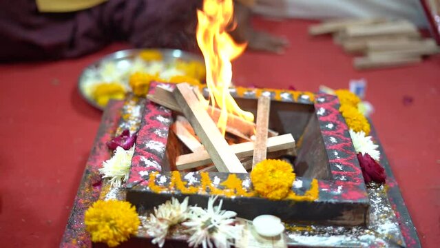 Slow Motion shot of Fire, Agni havan kund, Indian Havan Kund, rituals of hindus yagya at an Indian Wedding Function
