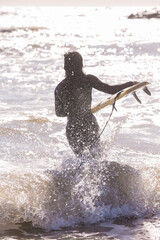 couple surfer  in ocean with surfboard. funny holidays health lifestyle and sport concept image, beautiful day