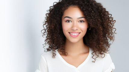 Beautiful young smiling woman with curly hair portrait isolated on white background.