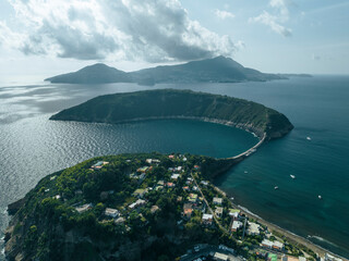 Aerial view of Vivara Island at sunset on Procida Island, view of the Natural reserve with Ischia Island on background, Flegree islands archipelagos, Naples, Campania, Italy.