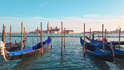 Beautiful seascape with gondolas on the blue sea water in Venice