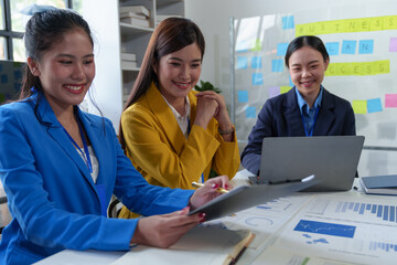 Asian business colleagues present and discuss investment project work and planning strategies....