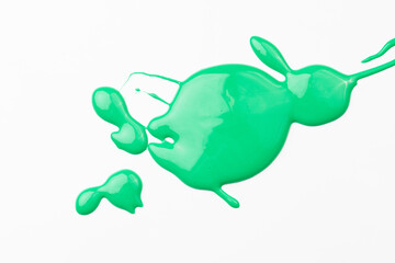 Acrylic paint blot, chaotic brushstroke, spot flowing on white paper background. Creative green color backdrop, fluid art.