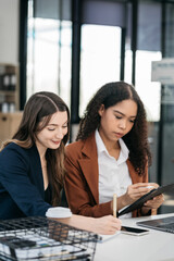 Two Young businesswoman discuss with new startup project Idea presentation.