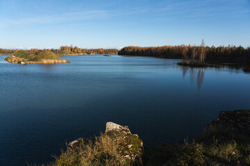 Nature of Estonia, Lake Vandjala with small islands in the center, photo on an autumn day.