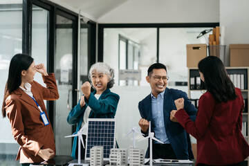 Successful business meeting, excited young person Keeping up arms and showing positive emotions, happy working in modern office