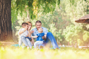 Fototapeta premium Happy family outdoors in nature