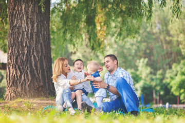 Fototapeta premium Happy family outdoors in nature