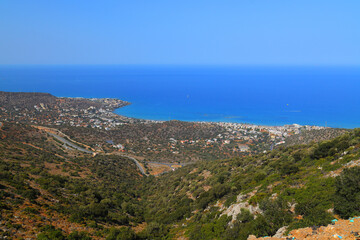 Scenic view of Malia bay with Malia and Stalida in the distance, Crete, Greece, Europe.
