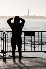 Silhouette of a women look into the distance