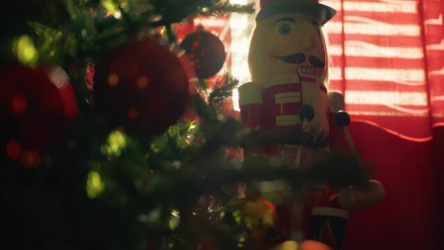 Nutcracker and Christmas tree at early morning in the hotel room