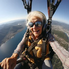 Tuinposter Selfie of senior woman during paragliding © 22Imagesstudio