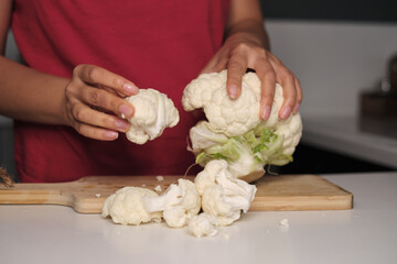 Soft hands tear vibrant cauliflower florets, a kitchen dance begins. Uncover the simple ways to infuse wellness in daily meals.