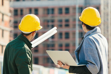 Business partners at construction site