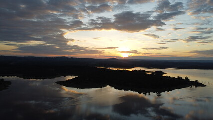 Fototapeta premium sunrise over the Nam Houm Reservoir lake