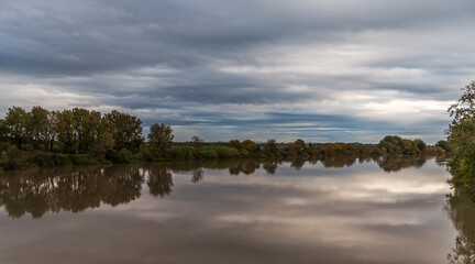 Obraz premium A very cloudy morning, on the Petit Rhône, between Occitanie and Provence (Camargue), in France