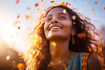 Happy Indian woman excited looking up in the confetti