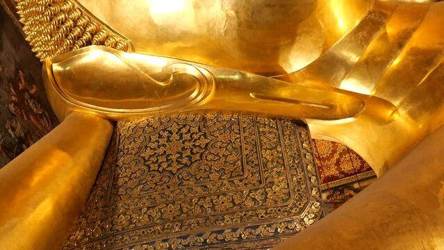 Reclining Buddha in Wat Pho, Bangkok. Wat Pho, Temple of the Reclining Buddha, is one of the most famous travel destinations in Thailand.