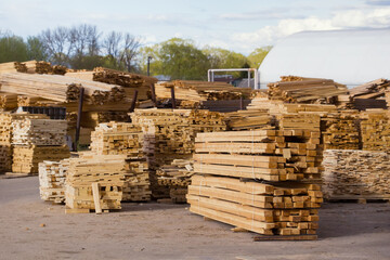 Lumber lies on the territory of a timber processing enterprise.