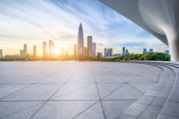 City square and skyline with modern buildings in Shenzhen at sunset, Guangdong Province, China.