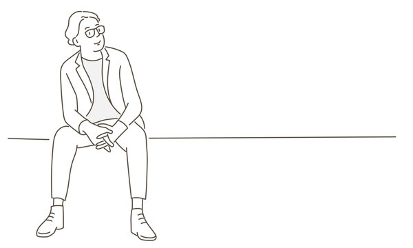 recommend clip art: Young man in glasses sitting
