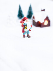 christmas decoration santa claus on white snow with copy space